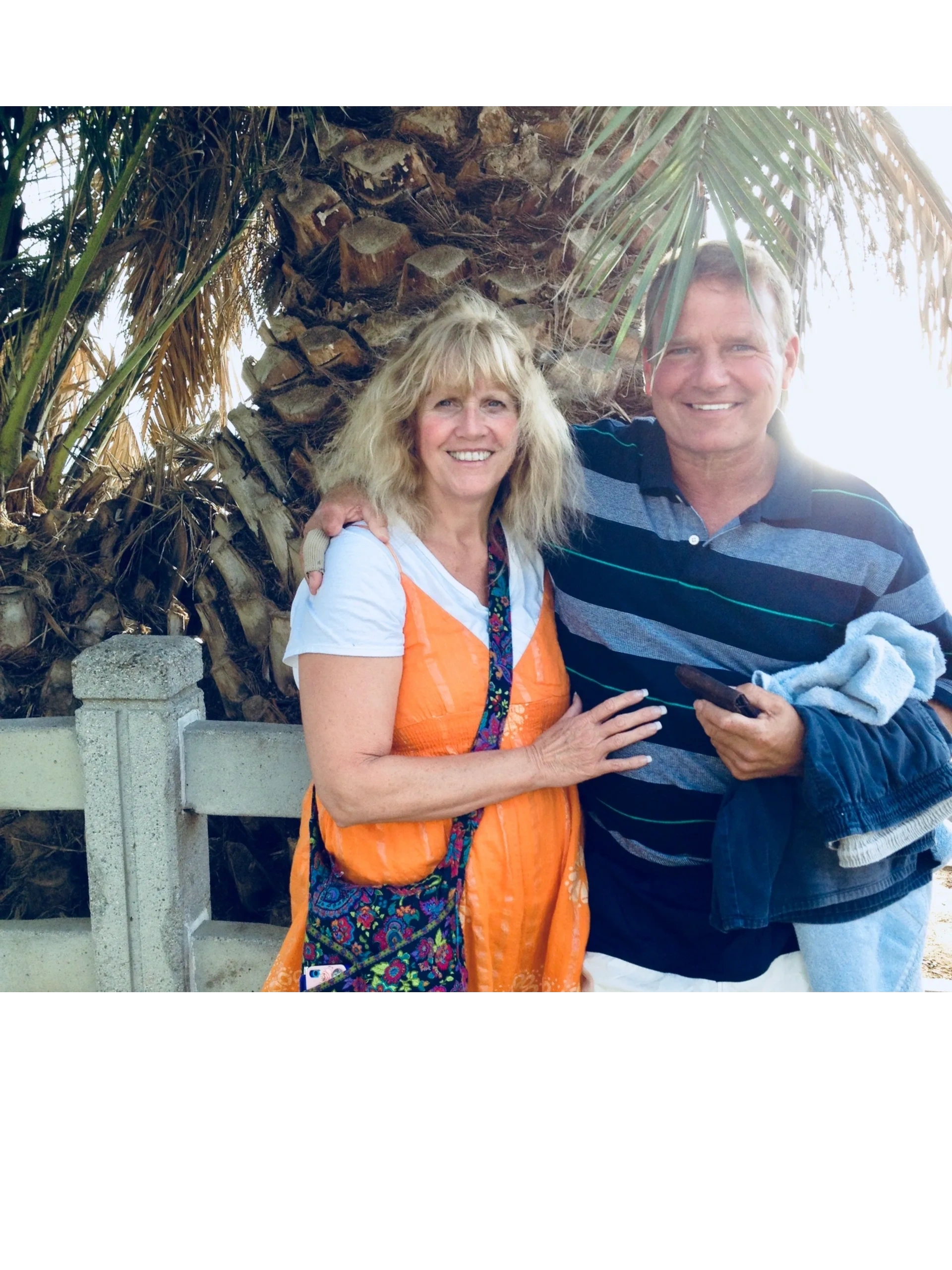 Couple smiling outdoors — the founders of Birthday Chocolates